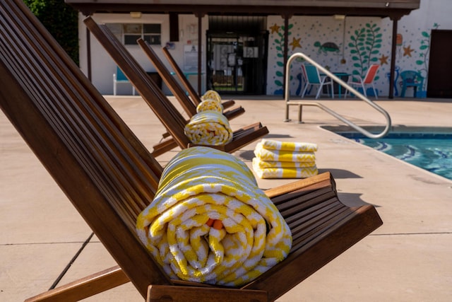 view of pool with a patio and a swimming pool