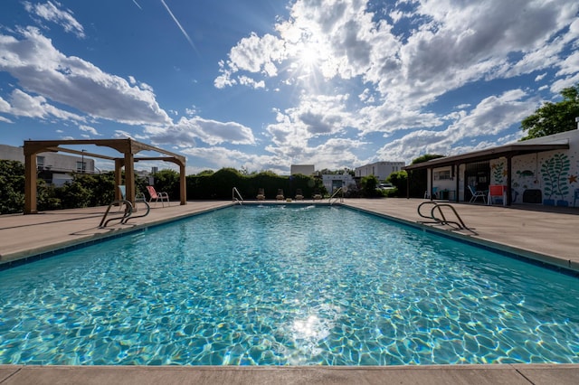 community pool with a patio area