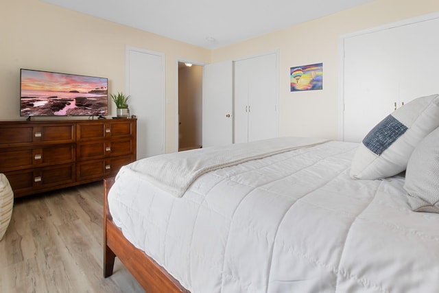 bedroom featuring light wood-style floors