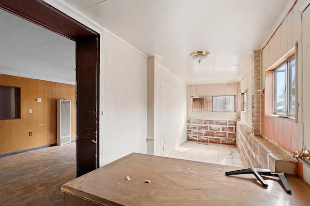 hall featuring wood walls