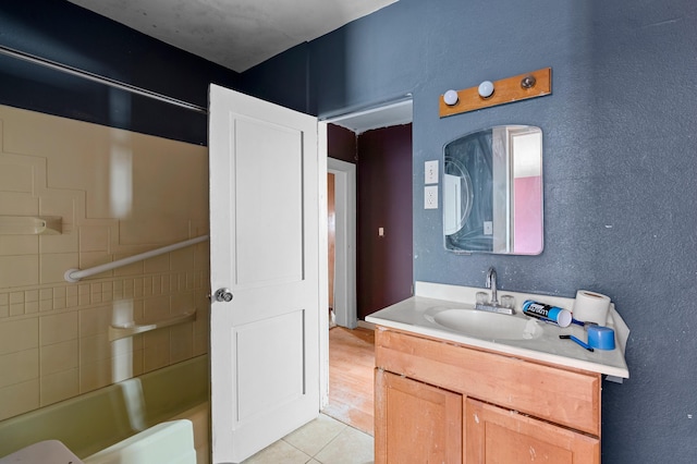 bathroom featuring tile patterned flooring and vanity