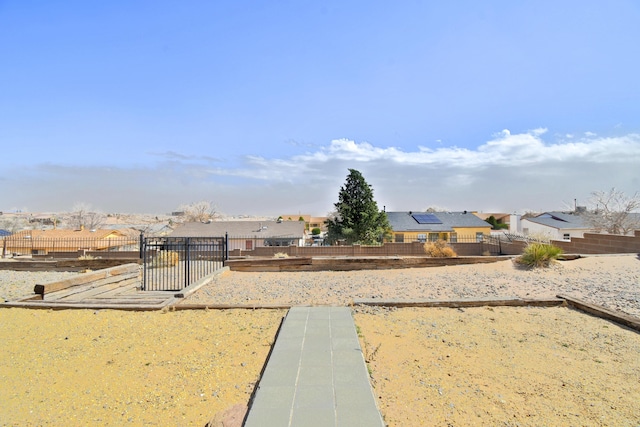 view of yard with fence and a residential view