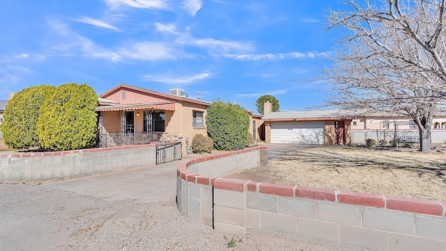 ranch-style house with stucco siding, driveway, and fence