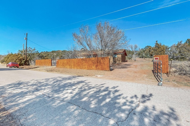 view of street featuring a gate