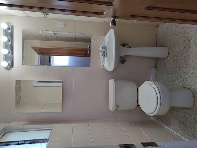 bathroom featuring tile patterned floors and toilet