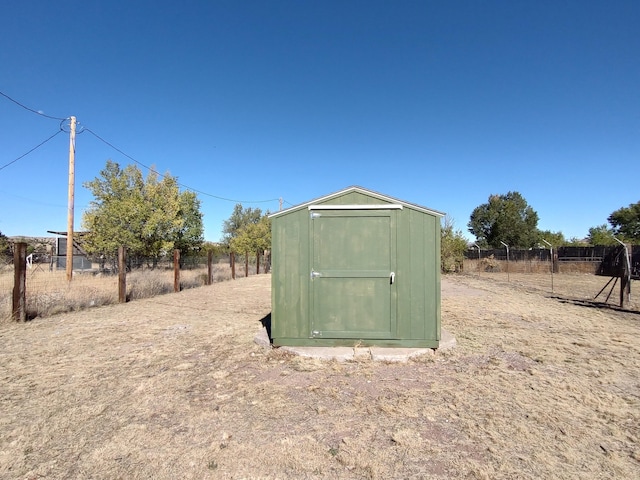 view of shed with fence