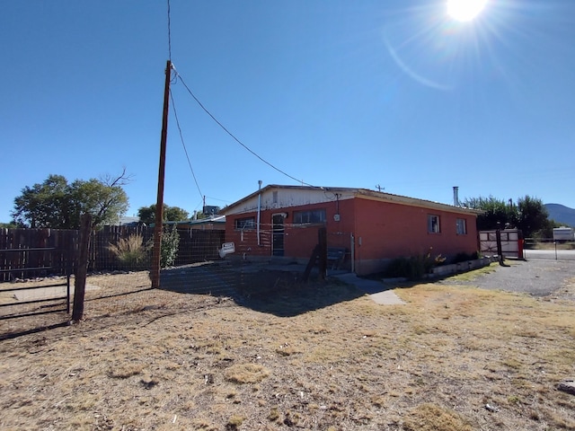 view of property exterior featuring fence