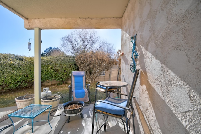 view of patio / terrace featuring fence