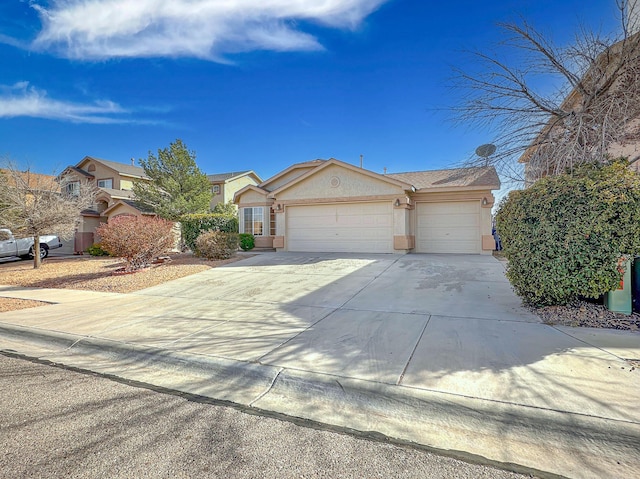 ranch-style house featuring an attached garage, concrete driveway, and stucco siding