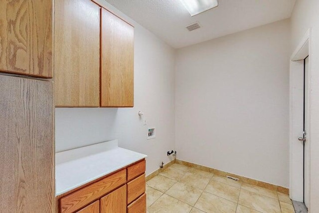 laundry room with cabinet space, visible vents, baseboards, gas dryer hookup, and hookup for a washing machine