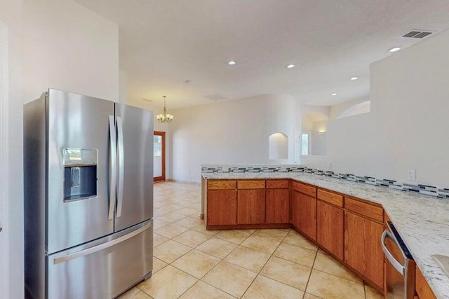 kitchen with light tile patterned floors, recessed lighting, visible vents, appliances with stainless steel finishes, and brown cabinets