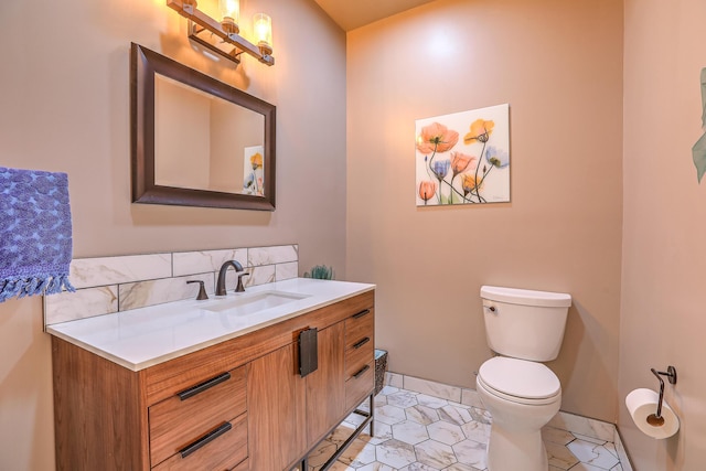 half bathroom with tile patterned flooring, toilet, vanity, baseboards, and backsplash