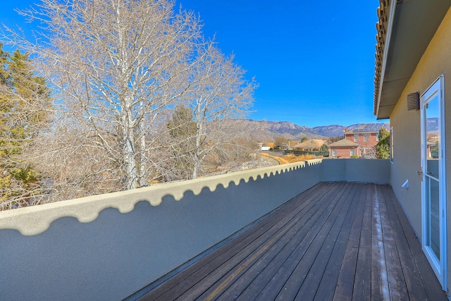 wooden terrace featuring a mountain view