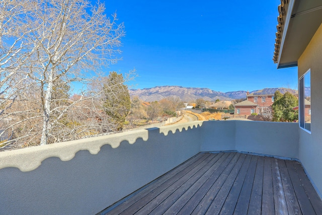 wooden terrace featuring a mountain view