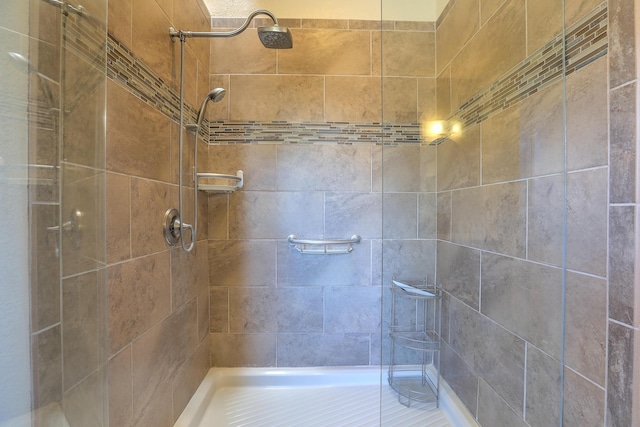 full bath featuring a shower stall