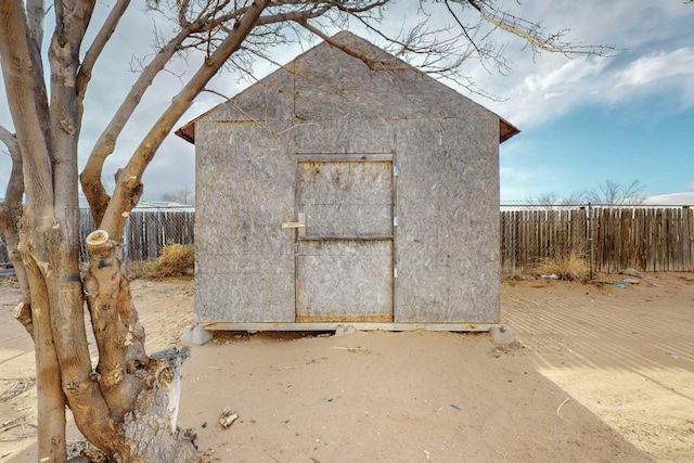 view of shed with fence