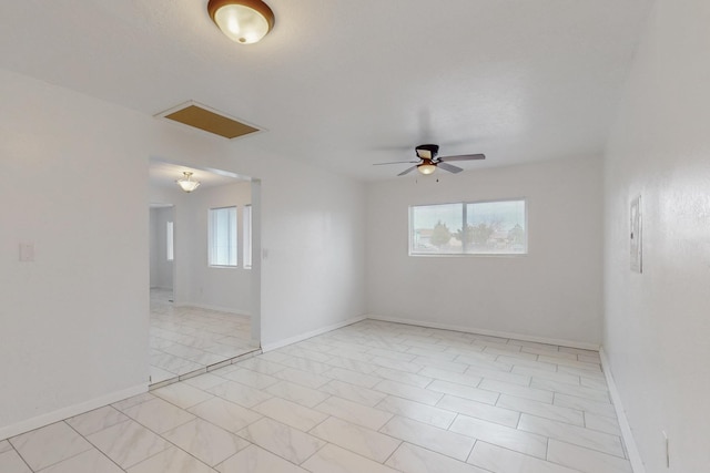 unfurnished room with a healthy amount of sunlight, baseboards, and ceiling fan