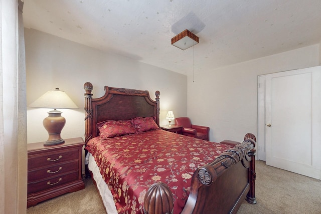 bedroom with light colored carpet