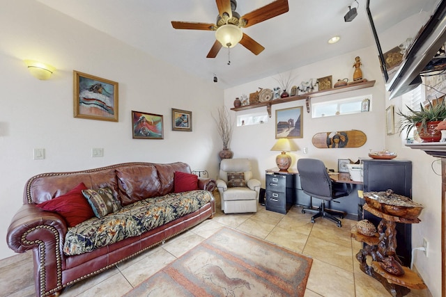 tiled living area with a ceiling fan