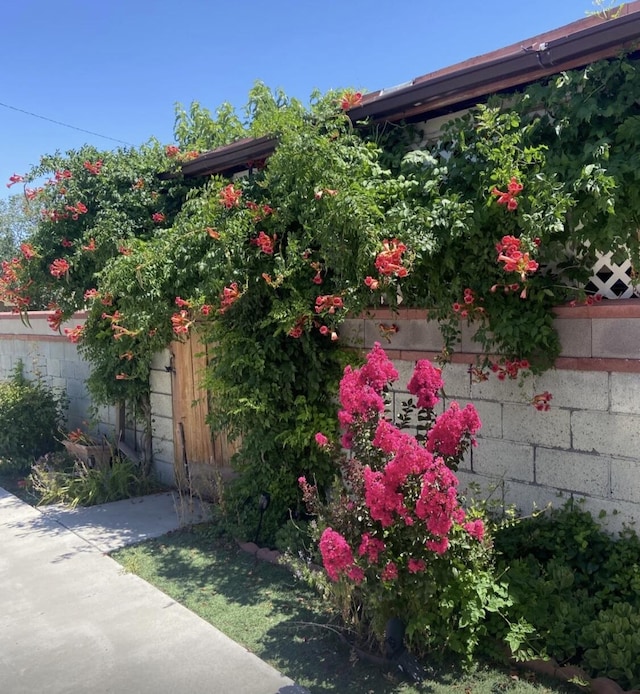 view of property exterior featuring fence