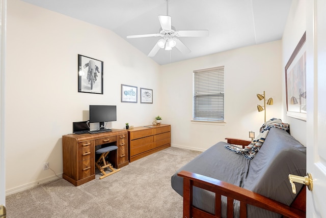 home office featuring lofted ceiling, light colored carpet, baseboards, and ceiling fan