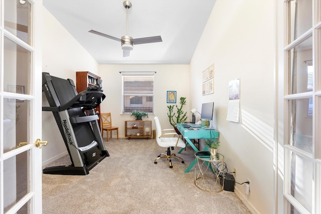 carpeted office with a ceiling fan, vaulted ceiling, french doors, and baseboards