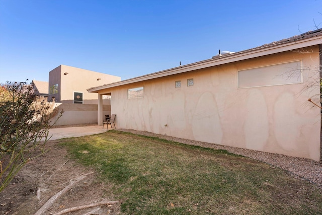 view of yard with fence and a patio area