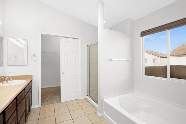 bathroom with a garden tub, tile patterned flooring, vanity, and a shower stall