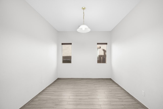 spare room with light wood-style floors