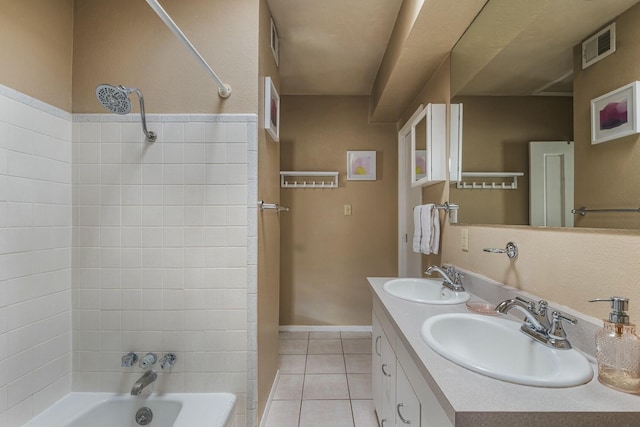 bathroom with tile patterned flooring, shower / tub combination, visible vents, and a sink