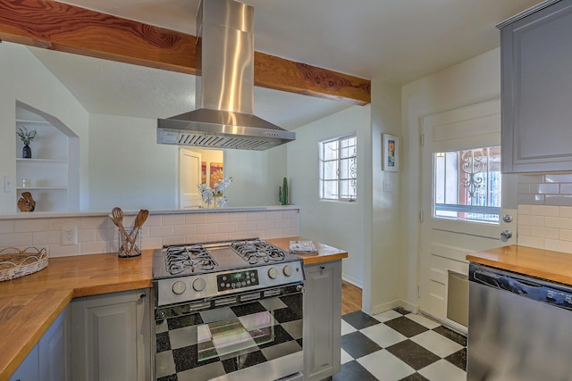 kitchen with stainless steel appliances, butcher block countertops, dark floors, and island exhaust hood