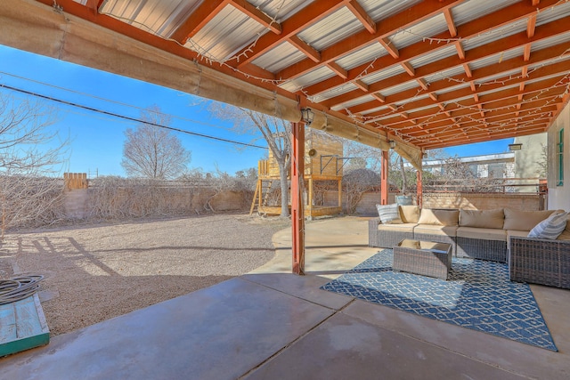 view of patio / terrace with outdoor lounge area and fence