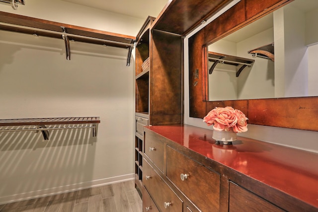 spacious closet featuring light wood-style floors