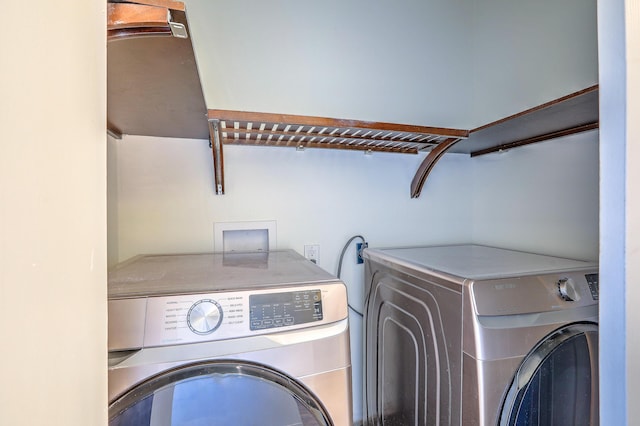 washroom with washing machine and dryer