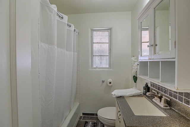 bathroom with toilet, tasteful backsplash, shower / bathtub combination with curtain, and vanity