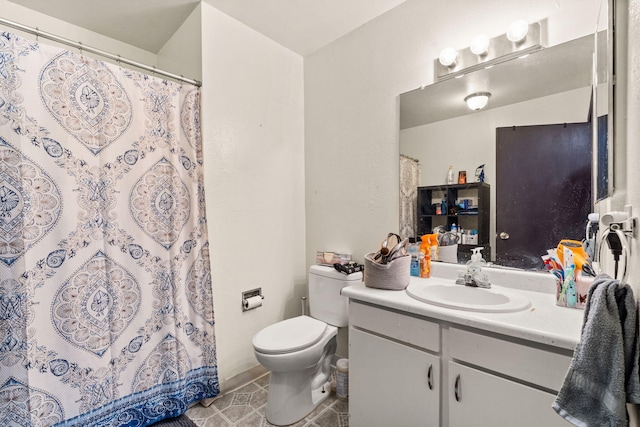 bathroom featuring tile patterned flooring, vanity, toilet, and a shower with curtain