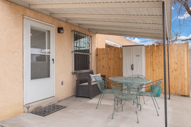 view of patio / terrace featuring fence and outdoor dining area