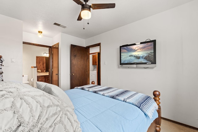 carpeted bedroom with a ceiling fan, baseboards, visible vents, and connected bathroom