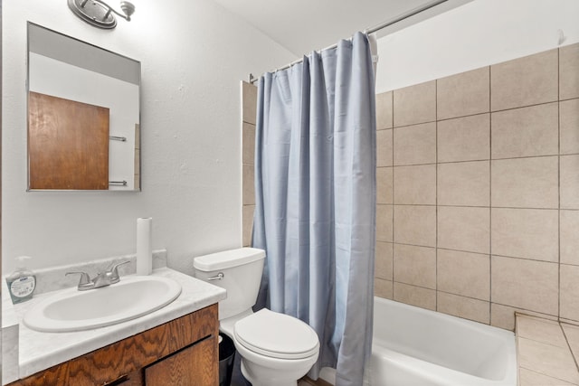 full bathroom with toilet, shower / tub combo, and vanity