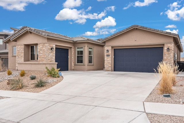 view of front facade with stone siding, stucco siding, driveway, and an attached garage