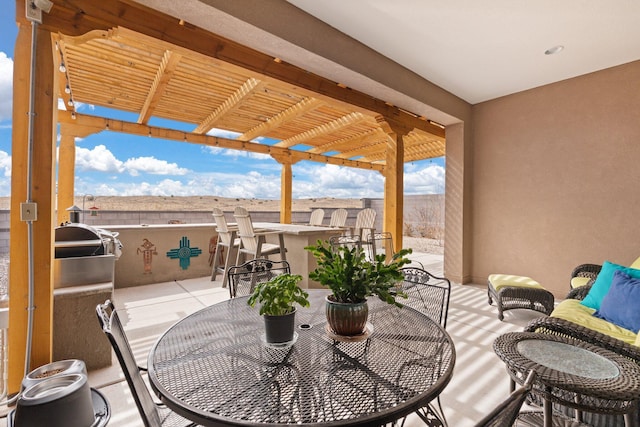 view of patio / terrace with outdoor dry bar, outdoor dining space, and a pergola