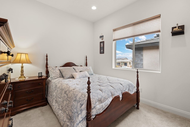 bedroom with recessed lighting, baseboards, and light colored carpet