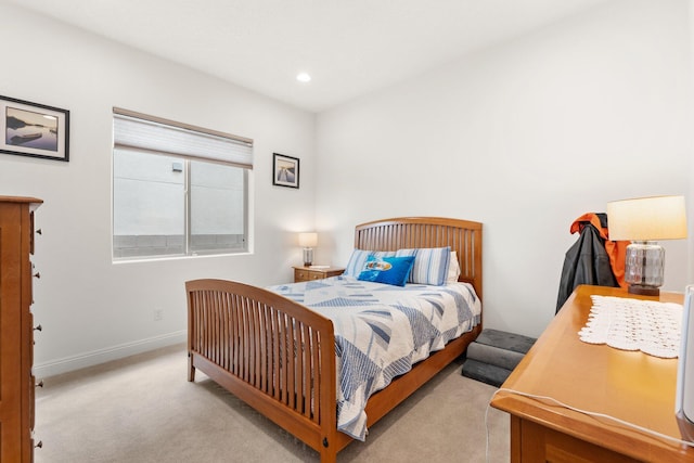 carpeted bedroom with recessed lighting and baseboards