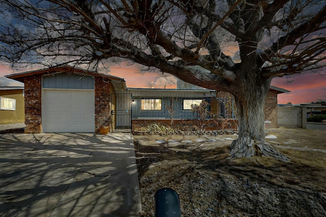 view of front of house with an attached garage and driveway