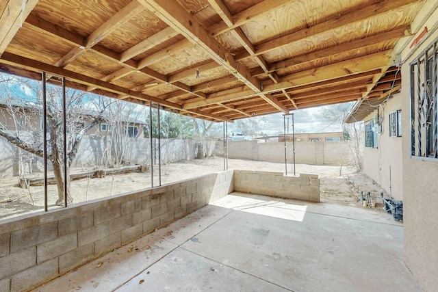 view of patio / terrace featuring fence