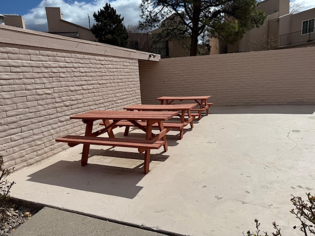 view of patio / terrace featuring fence