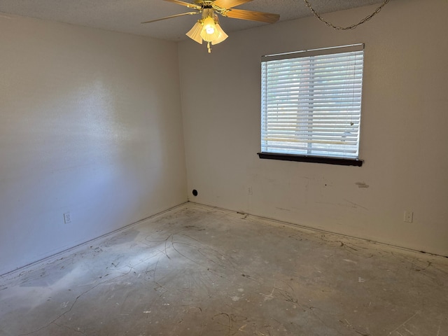 spare room with a ceiling fan