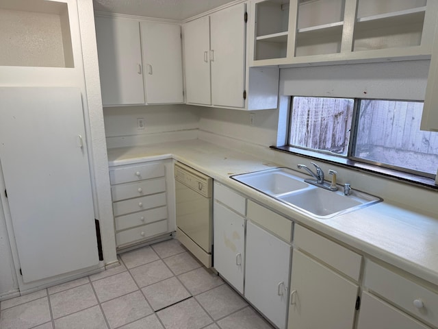 kitchen with light tile patterned floors, white dishwasher, a sink, light countertops, and open shelves