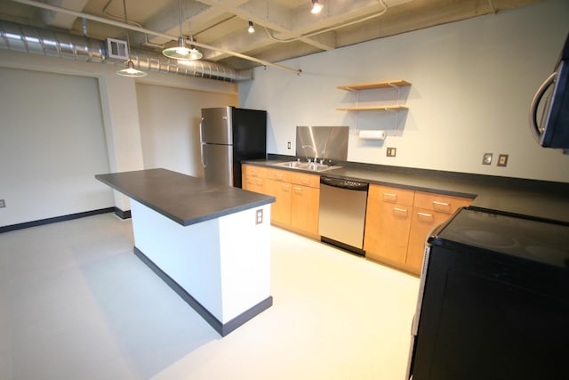 kitchen featuring stainless steel appliances, dark countertops, visible vents, light brown cabinets, and a sink