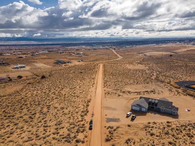 birds eye view of property with a rural view and a desert view